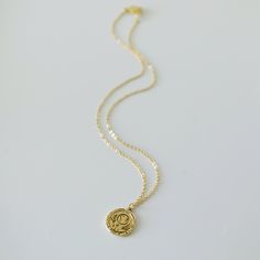 "Beautiful and lovely earth round pendant necklace. Made of gold plated earth round pendant with skinny gold plated brass chain. Soft and warm. Great for gift, everyday or special occasion. Your item will ship in a gift box. Please feel free to contact me if you have any questions. ♥ Chain length 15\"-22 ♥ Pendant 3/4\" ♥ Gold plated over brass / Black paste ♥ See more Rudiana Accessories Rudiana.etsy.com" Recycled Gold Charm Necklace With Round Pendant, Recycled Gold Round Pendant Charm Necklace, Gold Circle Charm Necklace For Gift, Minimalist Gold Charm Necklace With Birth Flower, Gold Charm Necklace With Birth Flower Pendant, Gold Coin Necklace With Moon Charm For Gift, Earth Necklace, Globe Necklace, World Map Necklace