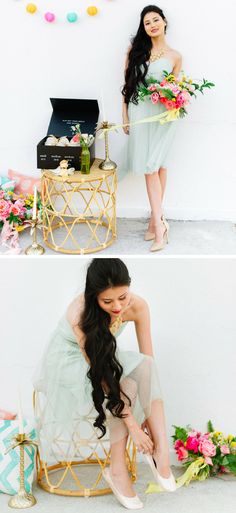 a woman sitting on top of a chair next to a table filled with flowers and confetti