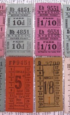 four different colored tickets with numbers and times printed on them, sitting next to each other