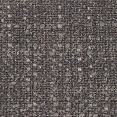 an up close shot of the texture of a tweed fabric with grey and white dots