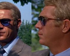 two men in suits and sunglasses are facing each other, one is looking off to the side