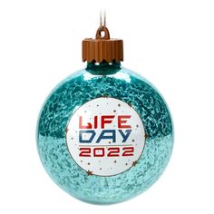 a glass ornament with the words life day on it