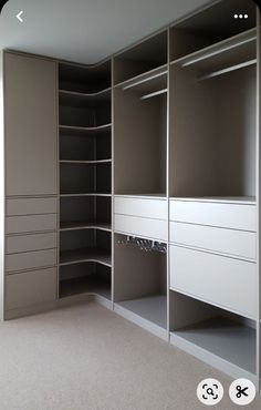 an empty walk in closet with shelves and drawers