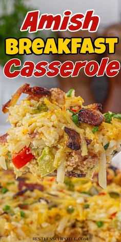 a close up of a casserole on a spoon with the words amish breakfast casserole above it