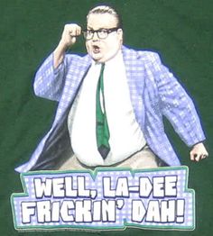 a man with glasses and a green tie standing in front of a t - shirt that says well, la - dee freckin'dah