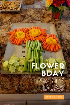 there is a flower bday party decoration made out of carrots and celery