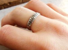 Christmas Cut off is Decemeber 5th for made to order items. Ready to ship items will be cut off Dec 15th Want 20% off this item? Go here to claim your coupon code! https://pintody.com/pages/discounts This Sterling Silver floral pattern ring features a unique design perfect for women or men. A floral design that has leaves and small flowers throughout the design. Great for wedding bands for both him and her or just to wear as a stacking ring with plain or other textures. The band has been oxidize Vintage Wedding Toe Ring With Flower Design, Elegant Engraved Wedding Ring, Vintage Wedding Flower Toe Ring, Elegant Stamped Ring Jewelry, Elegant Adjustable Engraved Flower Ring, Wedding Toe Ring With Intricate Design, Wedding Engraved Ring With Etched Details, Flower Shaped Ring With Intricate Design For Anniversary, Elegant Adjustable Flower Engraved Ring