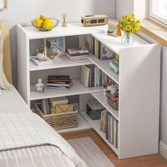 a bedroom with a bed, nightstand and bookshelf