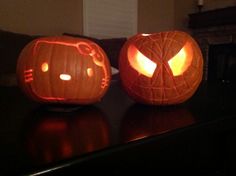 two pumpkins that have been carved to look like hello kitty