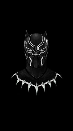 a black panther mask with spikes on it's face