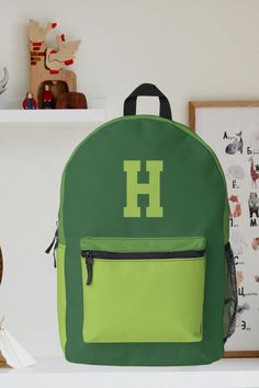 This cool and modern green backpack is ideal for your little boy if they need a new backpack. The backpack can be personalized with the inclusion of your choice of monogram initial which appears in a sports inspired font. This backpack could also make the ideal gift for any occasion. Green Backpack, Cool Boys, Green Sports, Green Backpacks, Back To School Supplies, Monogram Prints, School Stationery, Monogram Initials, School Supplies