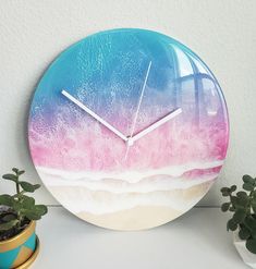 a clock that is on the side of a wall next to a potted plant