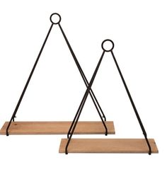 two metal and wood triangle shaped shelves on wooden bases, each with an iron ring at the top