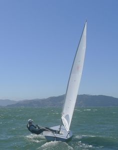 a person on a sailboat in the water