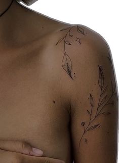 a close up of a person's chest with leaves on it