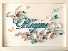 a white frame with butterflies and the words begin written in blue, pink, and orange