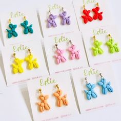 six pairs of earrings with bows on them