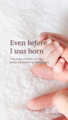 a baby's hand resting on the top of its mother's finger, with text that reads even before i was born you had written in your book everything about me