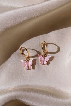 * 18 kt Gold Plated Pastel Butterflies * 14 kt Gold Filled Huggie Hoops Dainty, Simple, & Beautiful 18 kt Gold 3D Pastel Pink Butterflies on 14 kt Gold filled Huggie Hoops that are great for those with sensitive ears. These are super cute! They make a great gift for others or even for yourself. They are simple, dainty, and feminine. I also make these lovely butterfly hoop earrings with Sterling Hoops. Please choose which you would like from the drop down menu. * * What is gold filled? It is a very specialized process which involves fusing a layer of solid 14 kt Gold to brass through high heat and pressure. The bond that is created is a permanent one. The outer layer is solid gold and it is for this reason, 14 kt gold filled will wear like real gold and will remain bright and shiny. These s Hammered Hoop Earrings, Bar Stud Earrings, Girly Jewelry, Butterfly Earrings, Gold Plated Earrings, Ear Jewelry, Huggies Earrings, Cute Jewelry, Skater Dress