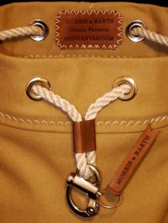 a close up of a person's pants with a rope on the front pocket