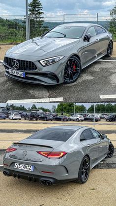 two different cars side by side, one is grey and the other is silver with black rims