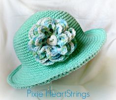 crocheted hats with flowers on them are shown in three different pictures, one is green and the other is blue