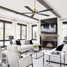 a living room filled with furniture and a fire place