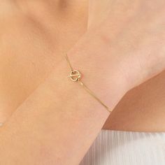 "14K Solid Gold Bracelet A minimal, classic and wear everyday, single or in combination with other bracelet of my collection! A delicate piece of jewelry, great gift for: 👧 Girl 🎁 Birthday ✨Anniversary 🎄 Christmas  Graduation ️👩 Engagement 😊 Best friend The Bracelet Details * Middle symbol completes with elegant chain * The middle symbol is 8.60 millimeters * Solid Gold (All Gold) Please carefully choose your ring size from the option menu during checkout. Should you have any questions, ple Unique Gold Bracelet, Bracelet Minimal, Gold Bracelet Simple, Gold Chain Bracelet, Solid Gold Bracelet, Bracelet Simple, Minimal Classic, Hand Bracelet, Simple Bracelets