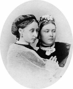 an old photo of two young women