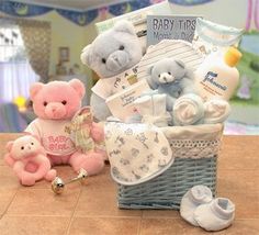 a baby gift basket with teddy bears and other items