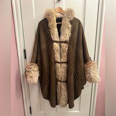 Vintage Loringhoven Lambswear. Stylish Vintage Brown Shearling Coat. Sheepskin Soft Distressed Suede Exterior With Soft Fur Interior. Fur Collar, Trim And Cuffs. Side Slits That Button. Marked As Women’s Small But It’s Roomy. There’s Some Small Darker Patches On Rear But Otherwise In Very Good Condition. Cape Outerwear With Faux Fur Trim For Cold Weather, Winter Cape Outerwear With Faux Fur Trim, Fall Cape Outerwear With Faux Fur Lining, Faux Fur Trim Cape For Cold Weather In Fall, Fall Cape With Faux Fur Trim For Cold Weather, Fall Cape With Faux Fur Lining, Brown Cape For Cold Weather, Fall Cape Fur Coat With Faux Fur Trim, Faux Fur Winter Cape Coat