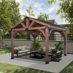 an outdoor living area with couches, tables and a pergolan style gazebo