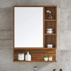 a bathroom with a sink, mirror and shelves on the wall next to each other