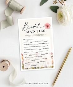 the bridal mad libs game is shown on a table next to some flowers