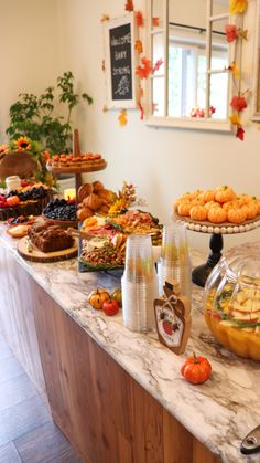 an assortment of food on a buffet table