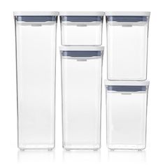 four clear plastic containers with lids on each side and one empty container in the middle