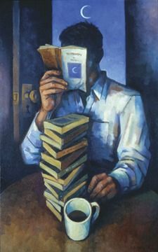 a man sitting at a table holding a stack of books next to a cup of coffee