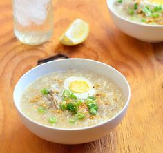 two bowls of soup with an egg on top