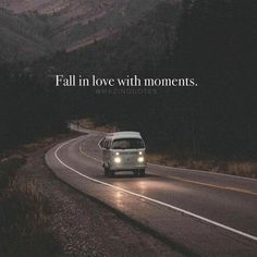 a car driving down a road with the words fall in love with moments