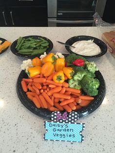 there are many different types of vegetables on the counter top, including broccoli and carrots