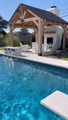 a pool with a gazebo next to it