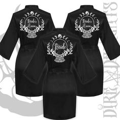 three black robes with the bride and groom's names on them