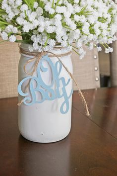 a mason jar filled with baby's breath flowers