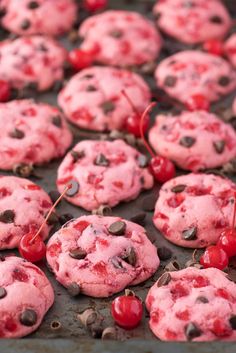 red chocolate chip cookies with cherries are on a baking sheet and the words, maraschino cherry chocolate chip cookies