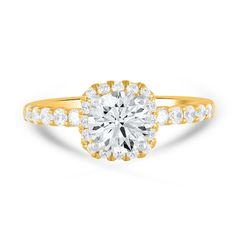 a yellow gold engagement ring with an oval cut diamond surrounded by small round brilliant diamonds