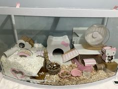 a display case filled with lots of different types of toys and decorations on top of a table