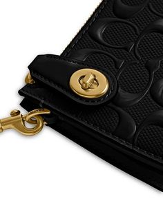 Removable shoulder strap, 12' drop.Dimensions: 8.25'W x 1.25'D x 4.75'H.Zip closure with turn-lock detail.Three interior card slots.Signature logo pattern.Brass-tone hardware.Lined.Patent leather.Imported.Web ID: 4839868 Classic Coach Wallet With Detachable Strap, Coach Luxury Wallet With Detachable Strap, Luxury Coach Wallet With Detachable Strap, Coach Rectangular Wallet With Gold-tone Hardware, Y2k Designs, Y2k Design, Leather Coach, 2023 Collection, Logo Pattern