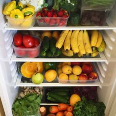 an open refrigerator filled with lots of different types of fruits and vegtables