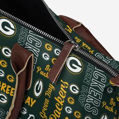 Everything from grocery runs to farmer's market trips are about to get a whole lot more fan friendly with the Green Bay Packers Spirited Style Printed Collection Tote Bag. Features All-over team-colored design so you can rep the team wherever you go Repeat team logo and team name displays, in case there were any doubts where your allegiances lie Repeat team-specific text accents that will set your team pride apart from your fellow fans Fastened handles for easy carrying Zipper closure to keep yo Functional Everyday Bags With Logo Print, Green Shoulder Bag With Logo For Daily Use, Green Rectangular Shoulder Bag For Sports, Green Everyday Bags With Logo, Green Rectangular Sports Shoulder Bag, Large Capacity Rectangular Bags For Sports Events, Rectangular Travel Bags With Logo Print, Functional Bags With Logo Print, Rectangular Travel Bag With Logo Print