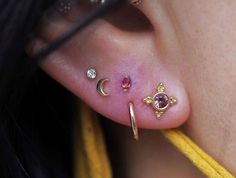 a close up of a person with ear piercings on their left and right ears